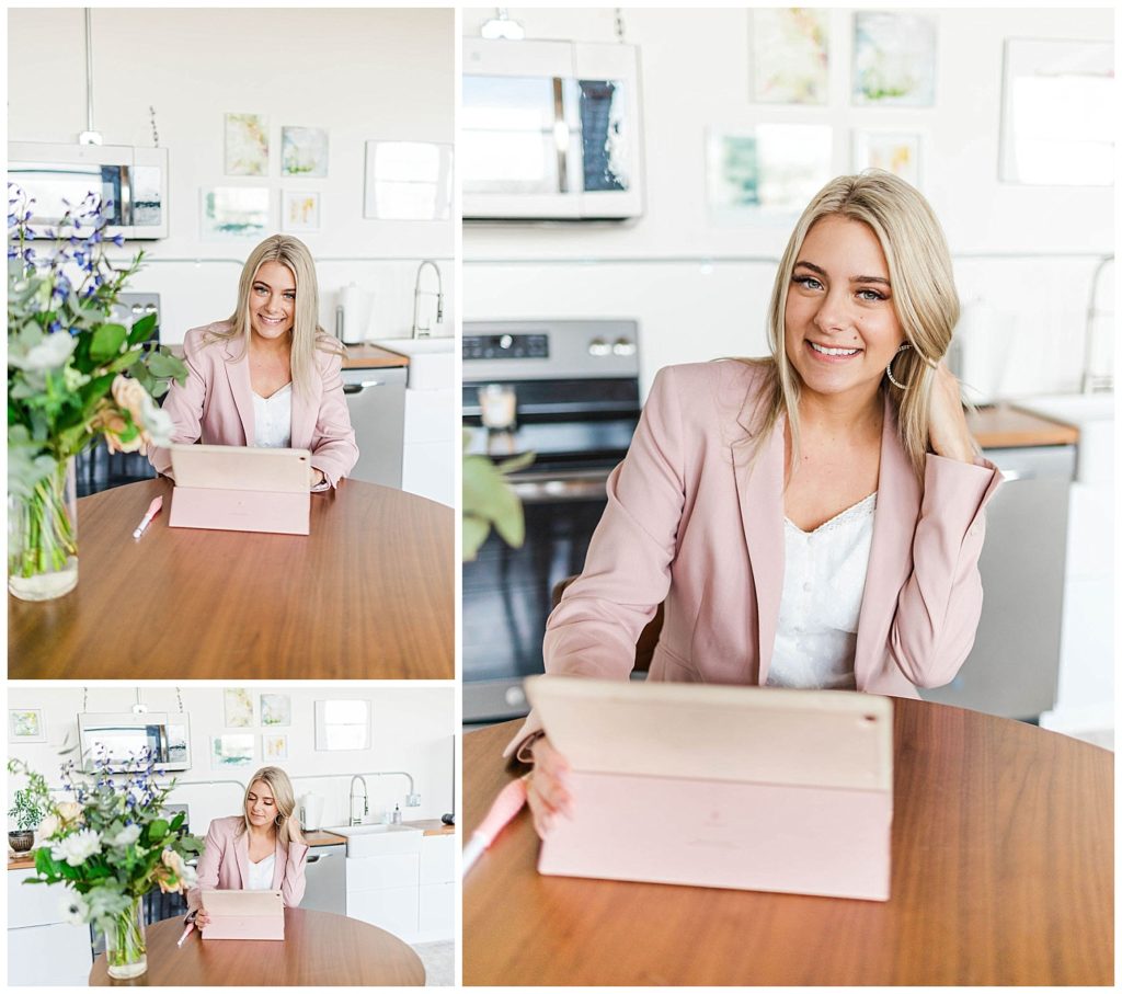 cosmetologist wearing a pink blazer posing in a kitchen for photos