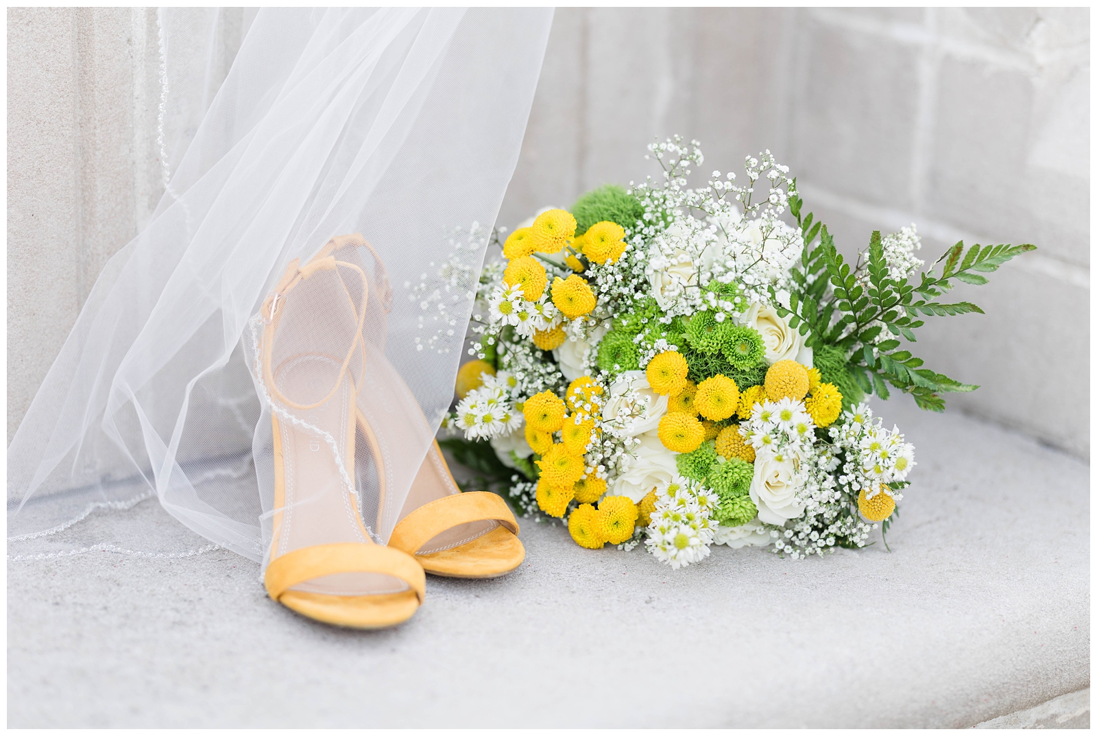 Yellow bridal bouquet and wedding shoes