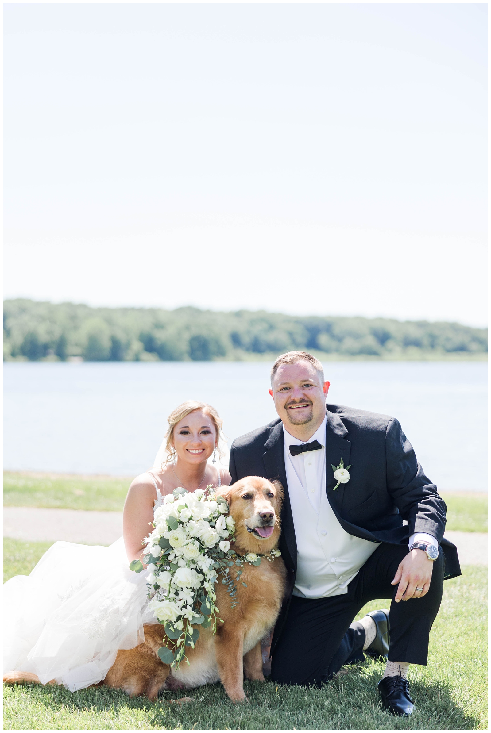 Bride and groom wedding photo with dog