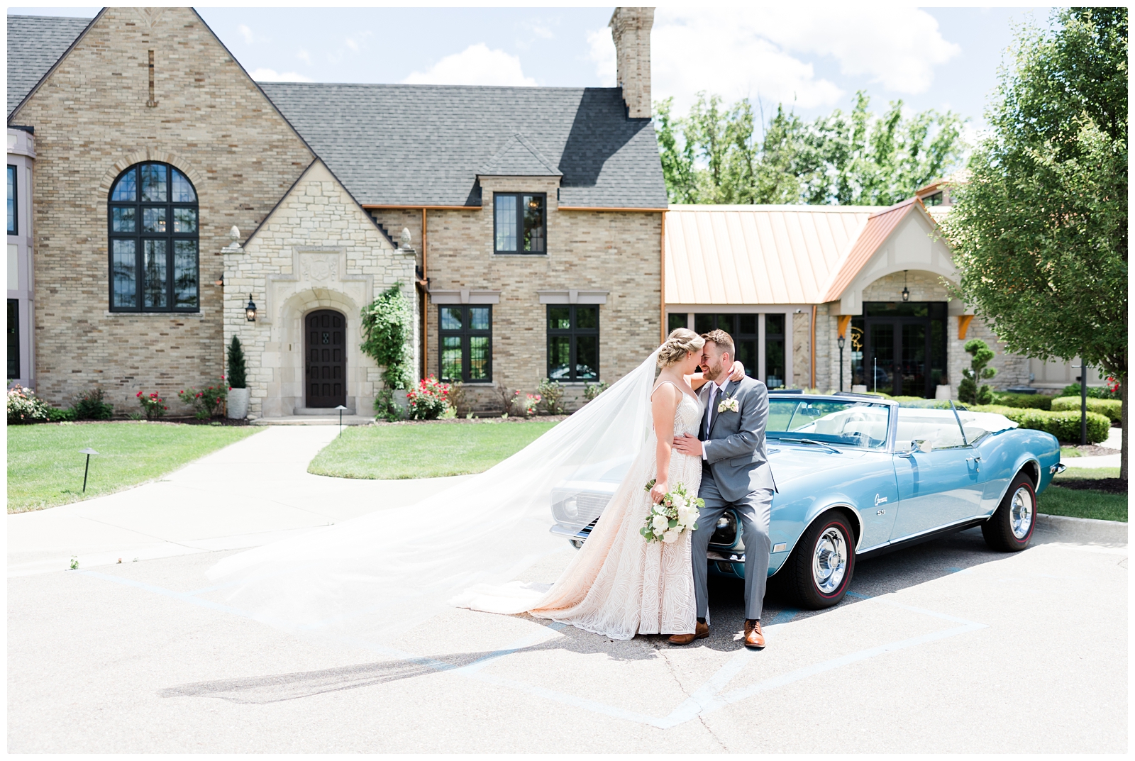 bride and groom photo with convertible 