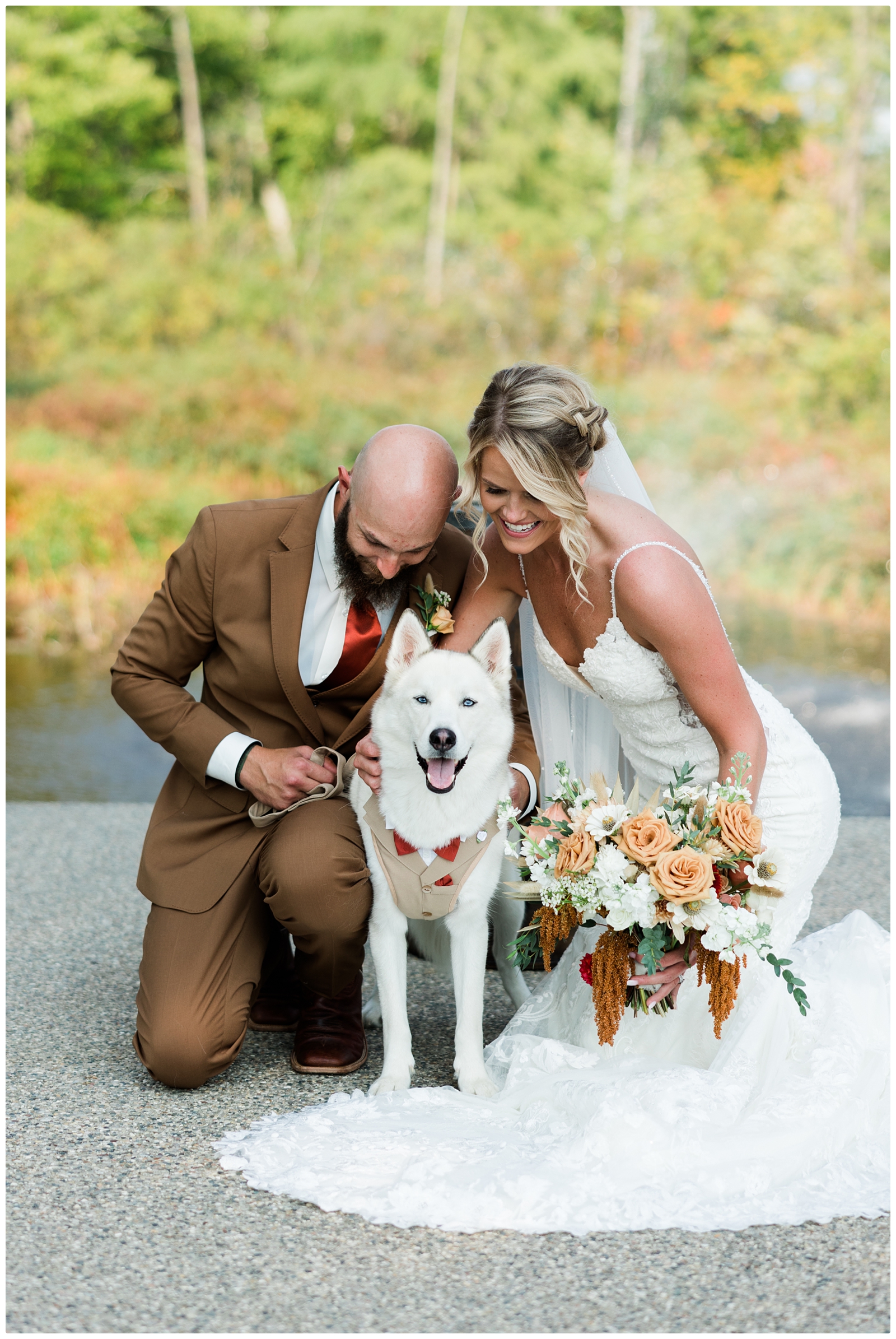 bride and groom photo with dog