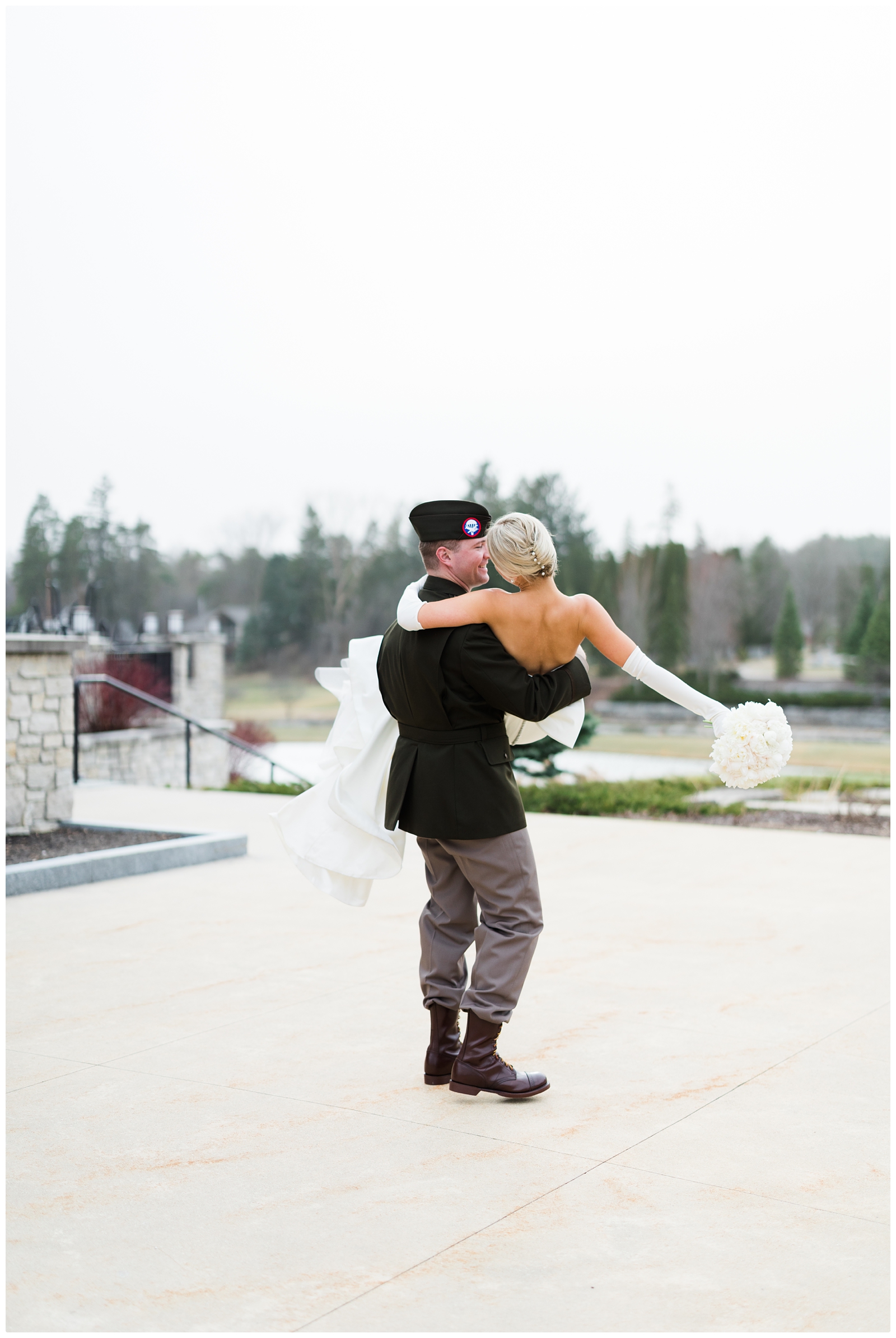 groom holding bride during their Midland MI wedding