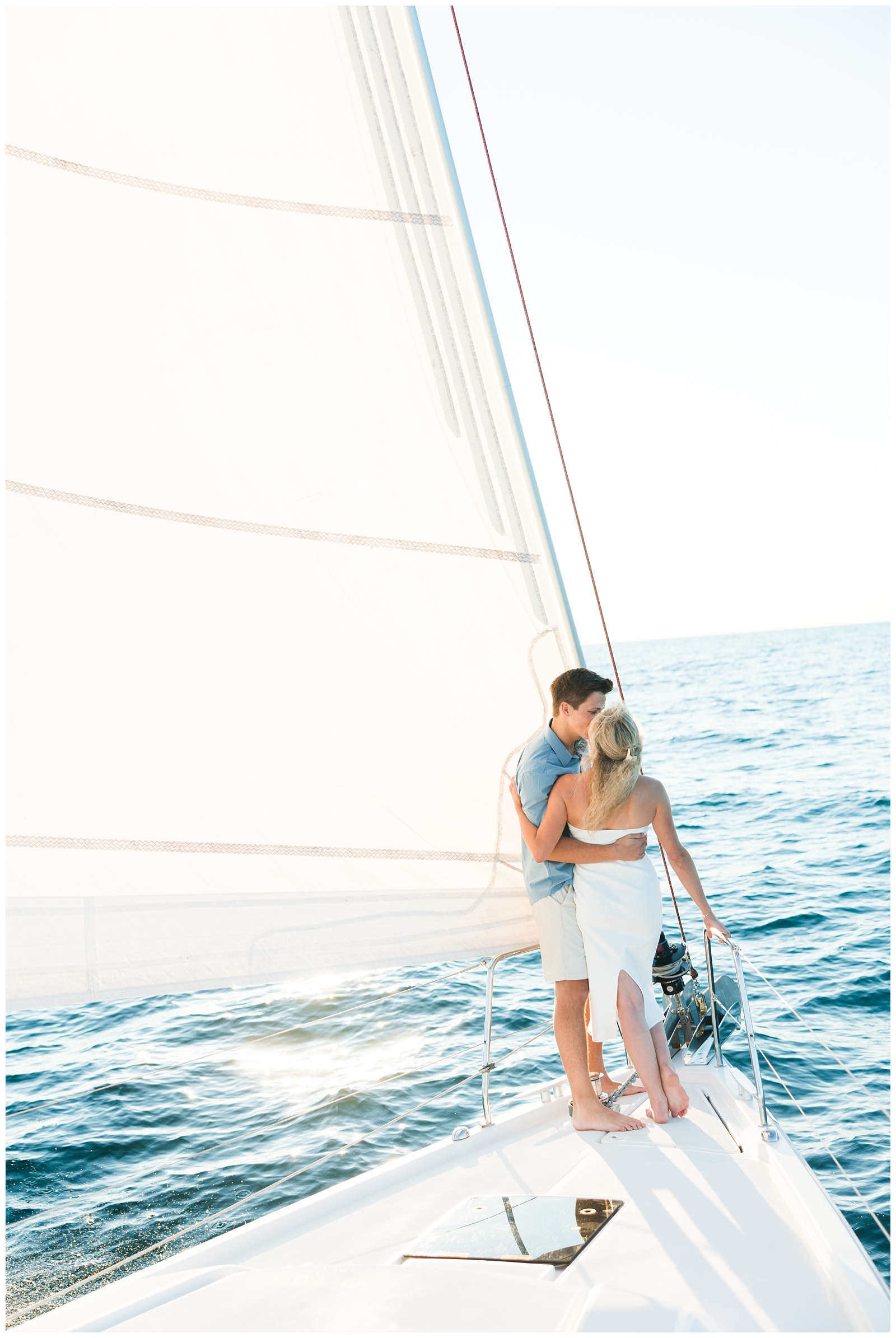 Sailboat Engagement Photos during sunset in michigan