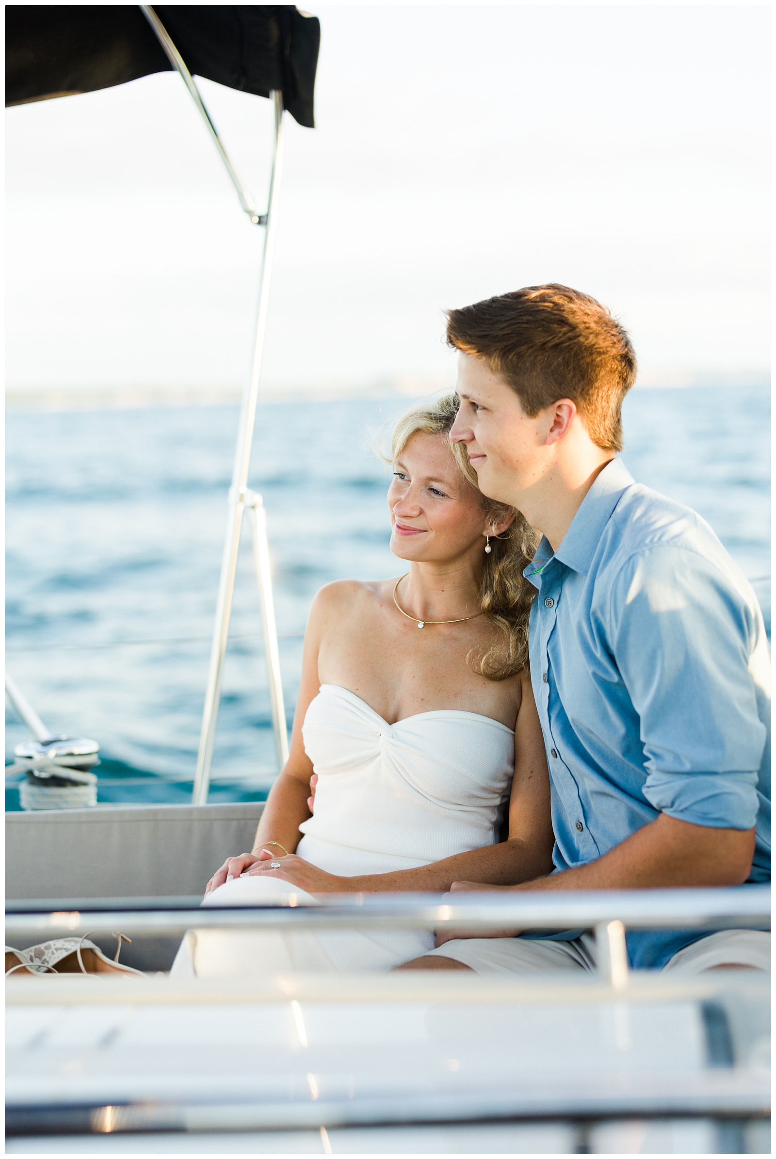watching the sunset during Sailboat Engagement Photos