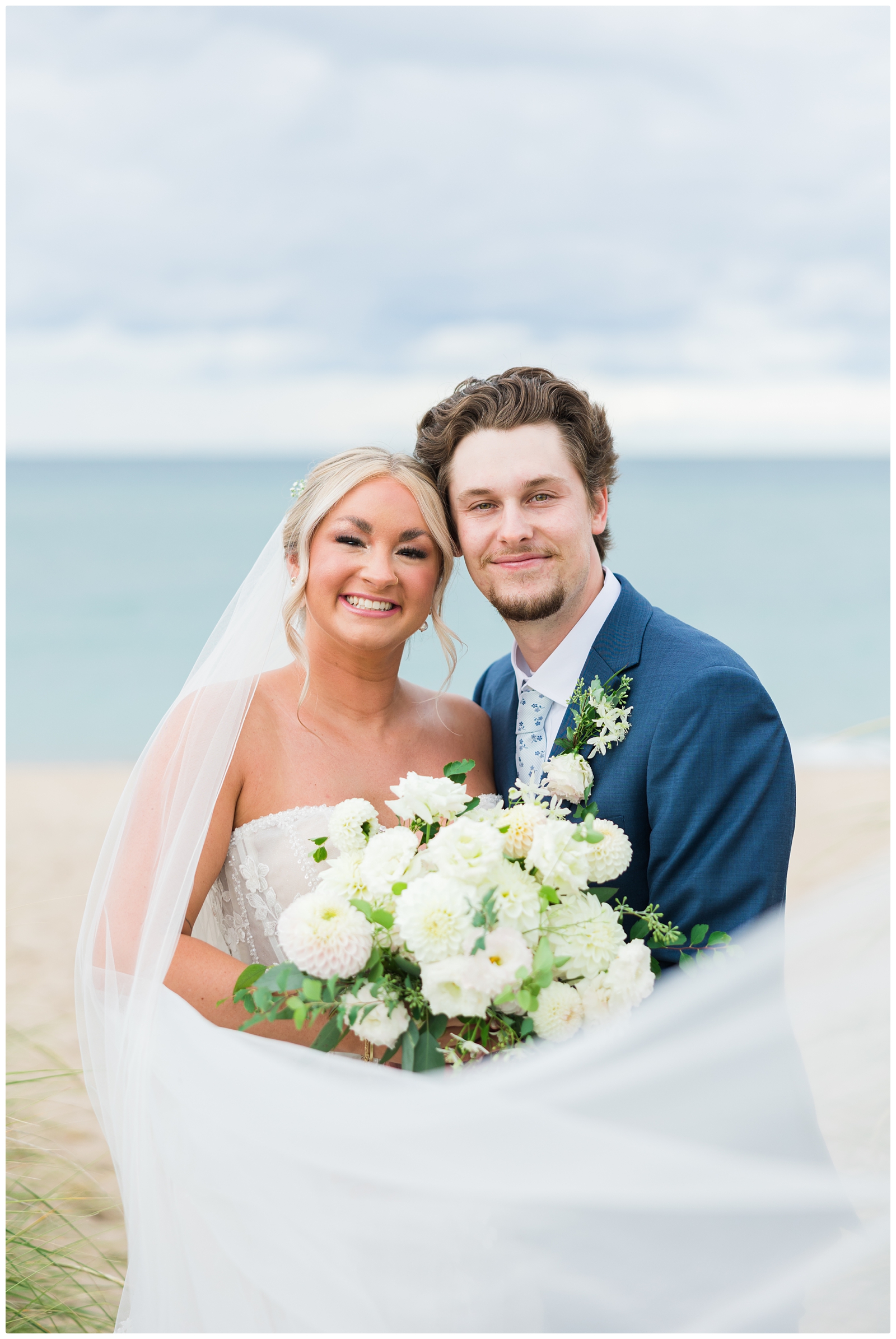 lake michigan elopement wedding photo of bride and groom smiling at the camera