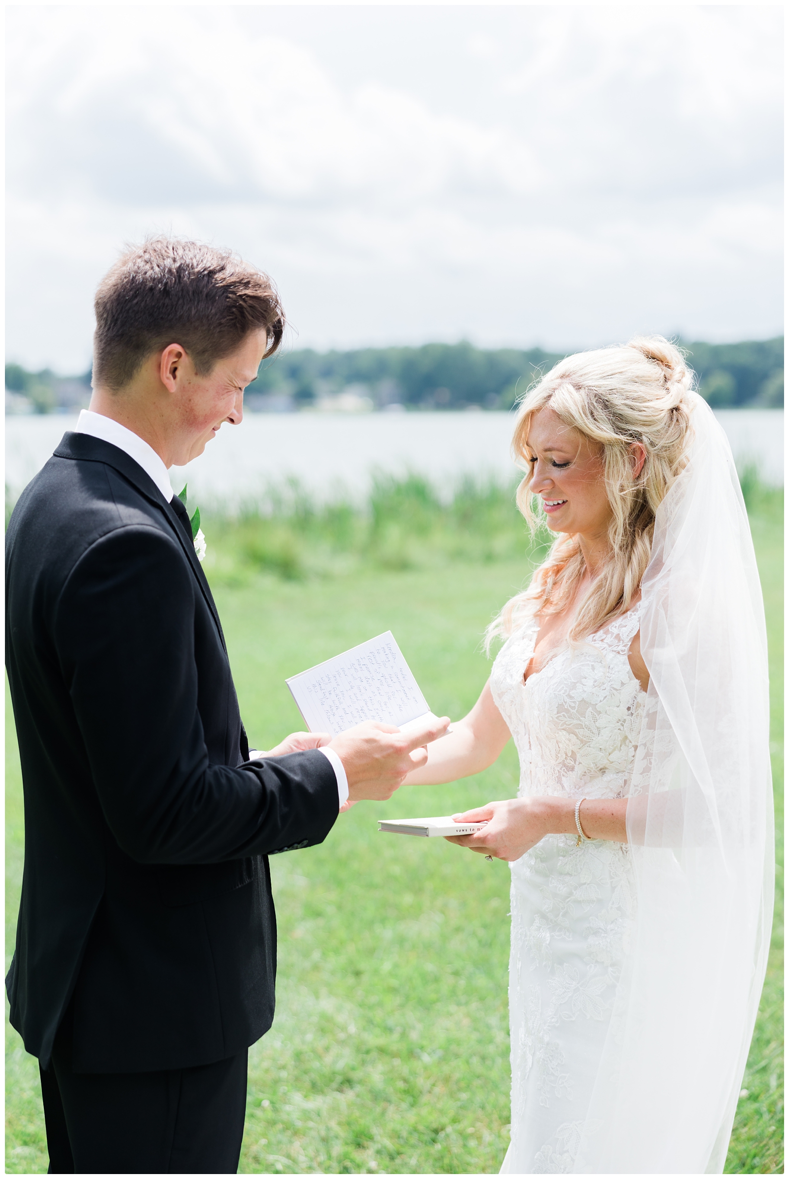 bride and groom sharing vows at their White Birch Wedding Barn wedding