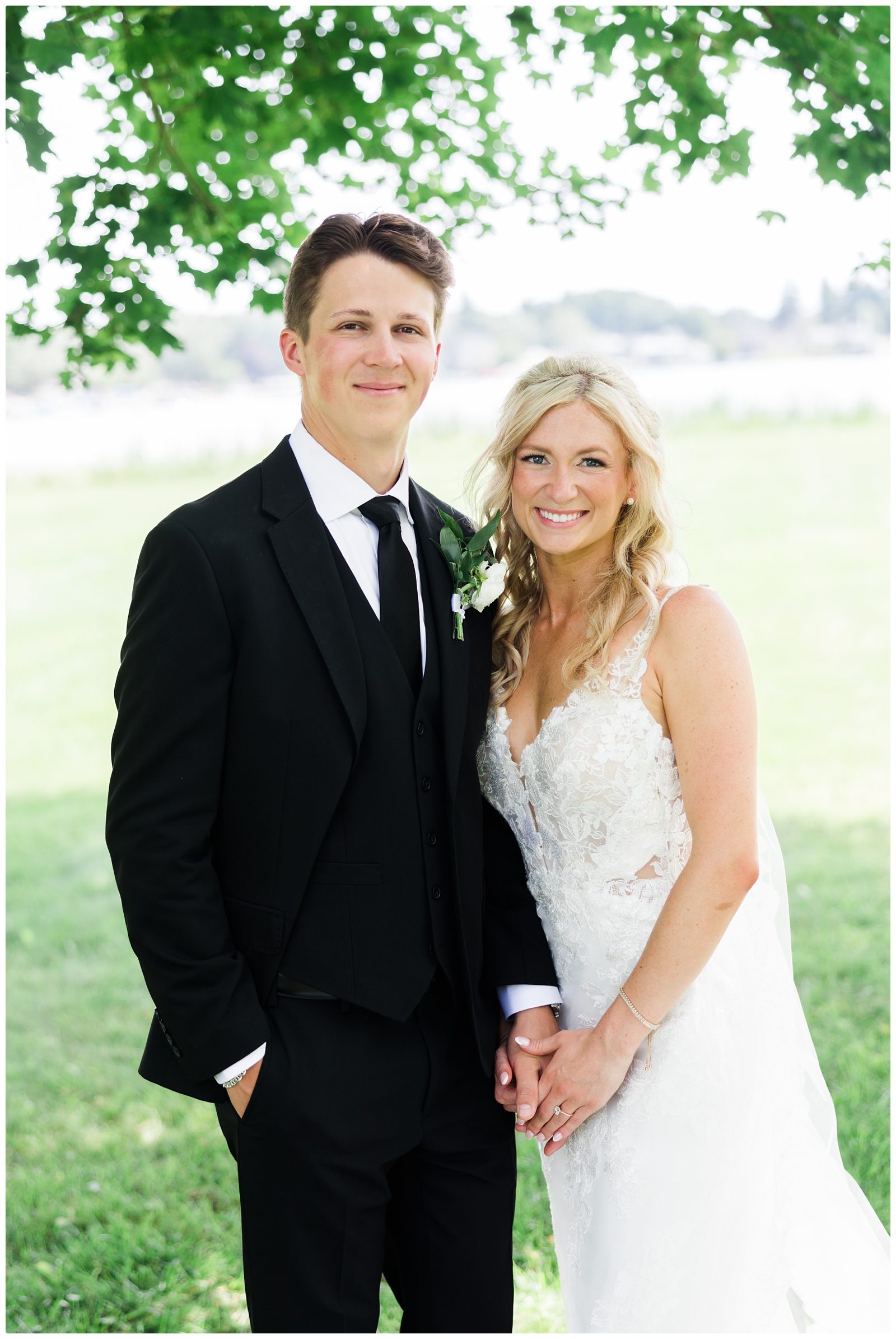 bride and groom photo smiling at camera during their White Birch Wedding Barn wedding