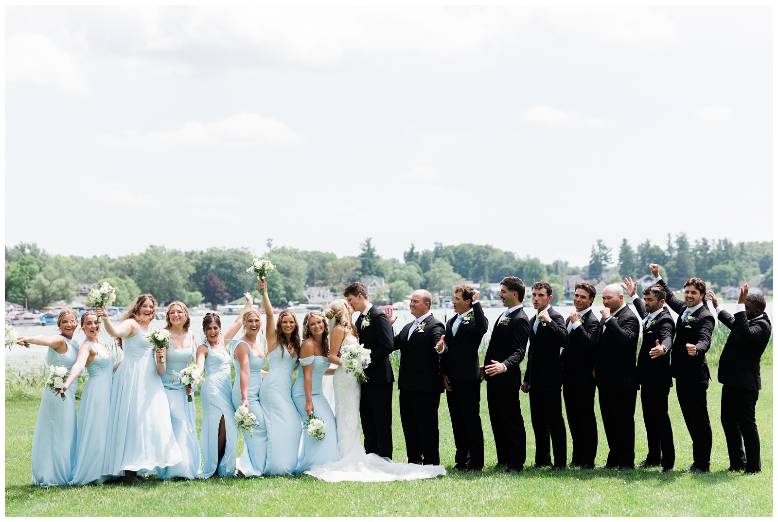 wedding party photo cheers at White Birch Wedding Barn